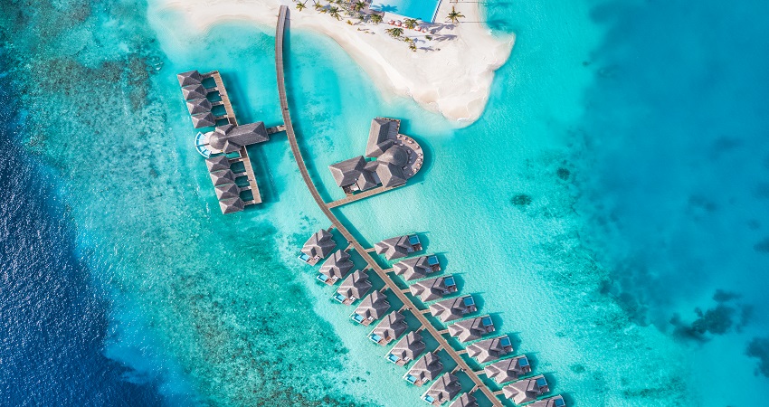 aerial-top-view-pool-villas-bungalows-maldives-paradise-tropical-beach-amazing-blue-turquois.jpg
